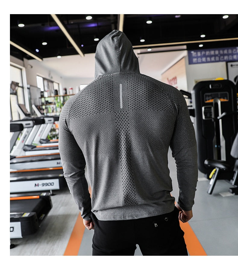 a man wearing grey dri-fit WRATH hoodie facing back