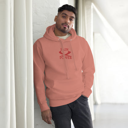a man wearing a dusty rose   wrath  hoodie with pain and power embroidered at the center chest